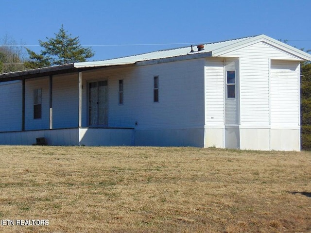 309 Elizabeth Russell Ln, Speedwell, TN 37870 - back of house with metal roof, a porch, and a lawn