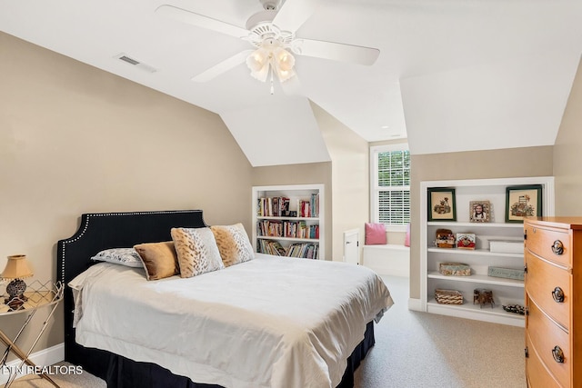 carpeted bedroom featuring lofted ceiling and ceiling fan