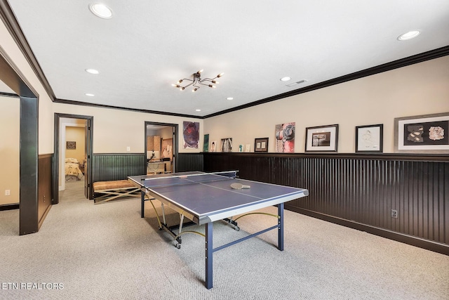 playroom with ornamental molding, a wainscoted wall, recessed lighting, and light carpet