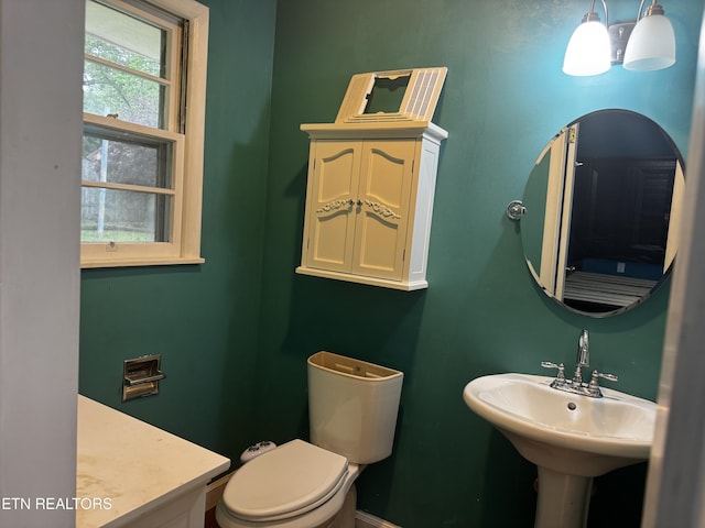 bathroom with toilet and a sink
