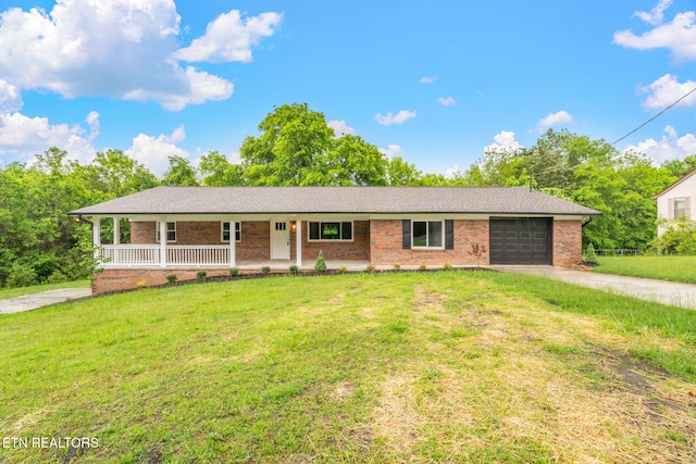 7220 Beelertown Rd, Powell, TN 37849 - ranch-style home with a porch, driveway, a garage, and brick siding
