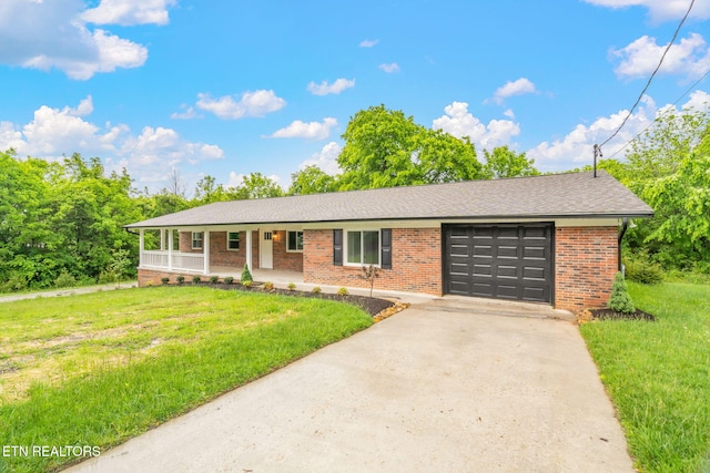 7220 Beelertown Rd, Powell, TN 37849 - ranch-style house featuring a garage, a porch, brick siding, a front lawn, and concrete driveway