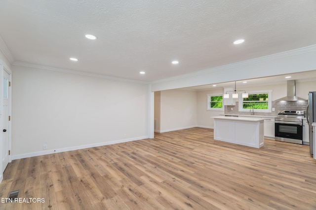 7220 Beelertown Rd, Powell, TN 37849 - unfurnished living room with light wood-type flooring, ornamental molding, baseboards, recessed lighting, and a textured ceiling