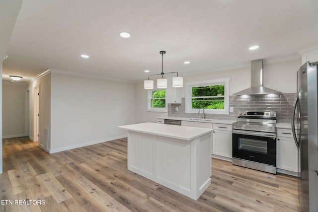 7220 Beelertown Rd, Powell, TN 37849 - kitchen with stainless steel appliances, wall chimney exhaust hood, crown molding, decorative backsplash, and a center island