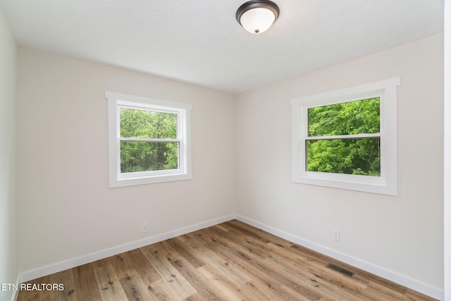 7220 Beelertown Rd, Powell, TN 37849 - spare room with healthy amount of natural light, baseboards, and light wood-style flooring