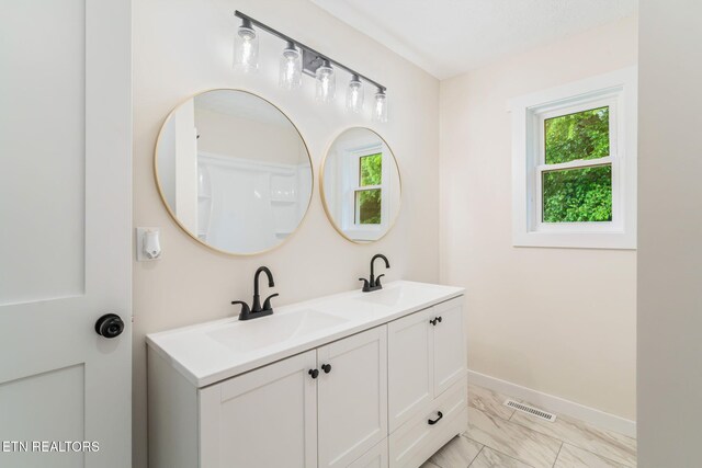 7220 Beelertown Rd, Powell, TN 37849 - bathroom with marble finish floors, plenty of natural light, double vanity, and baseboards
