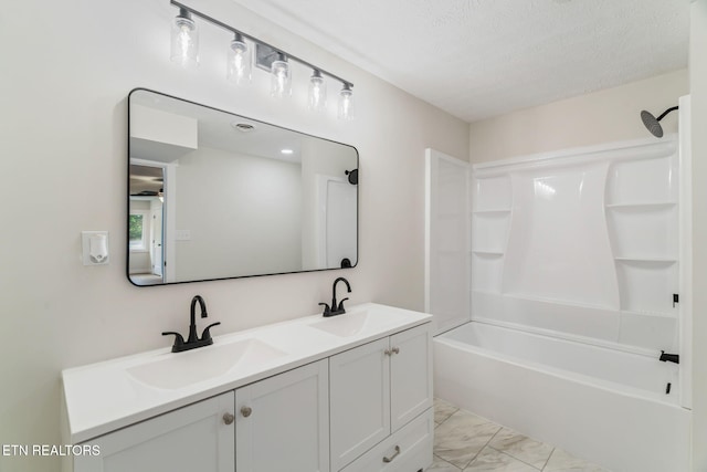 7220 Beelertown Rd, Powell, TN 37849 - bathroom featuring double vanity, washtub / shower combination, marble finish floors, and a textured ceiling