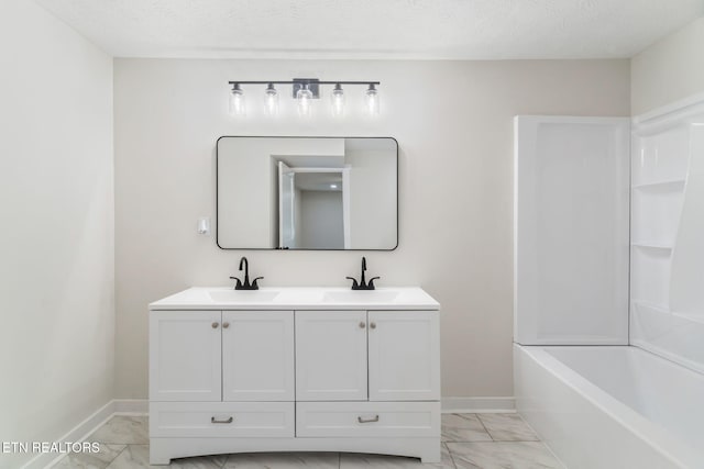 7220 Beelertown Rd, Powell, TN 37849 - bathroom featuring marble finish floors, double vanity, baseboards,  shower combination, and a textured ceiling