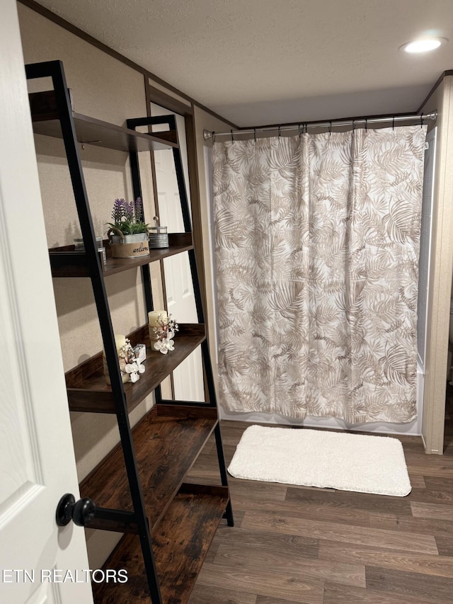 bathroom with wood finished floors