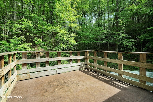 balcony featuring a view of trees