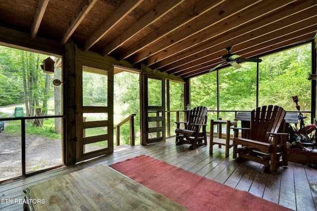 sunroom featuring ceiling fan