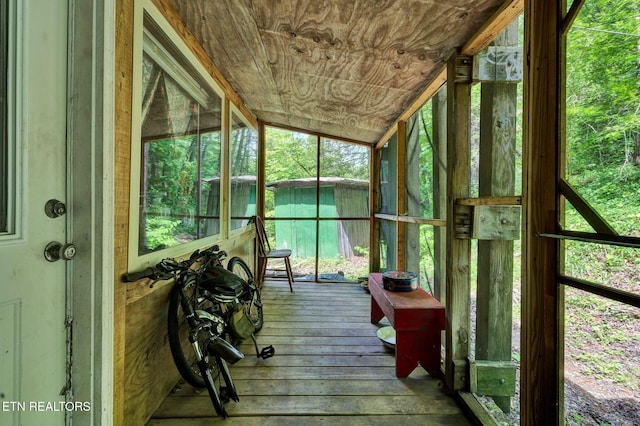 sunroom / solarium featuring lofted ceiling
