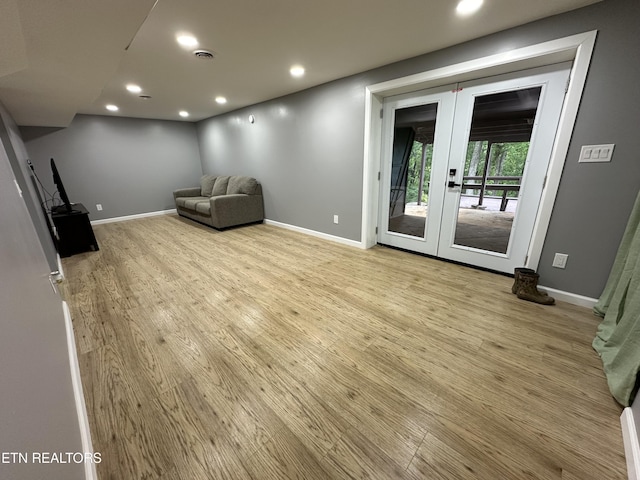 unfurnished room featuring french doors, recessed lighting, and wood finished floors