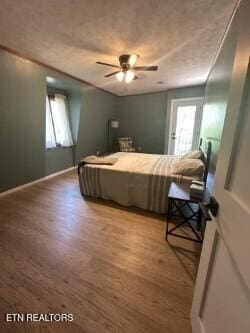 bedroom featuring a ceiling fan and wood finished floors