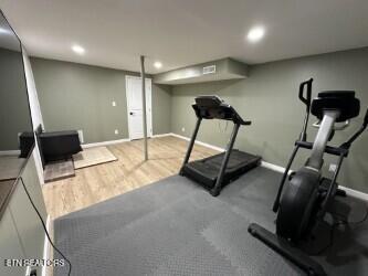 workout area with wood finished floors, baseboards, and recessed lighting
