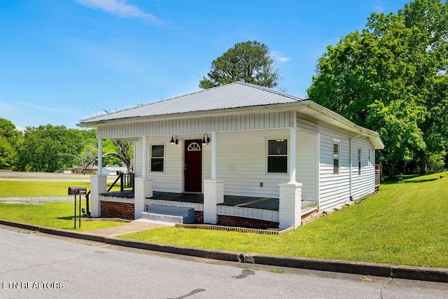 bungalow-style house with a porch and a front yard