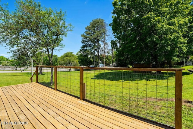 wooden deck with a lawn