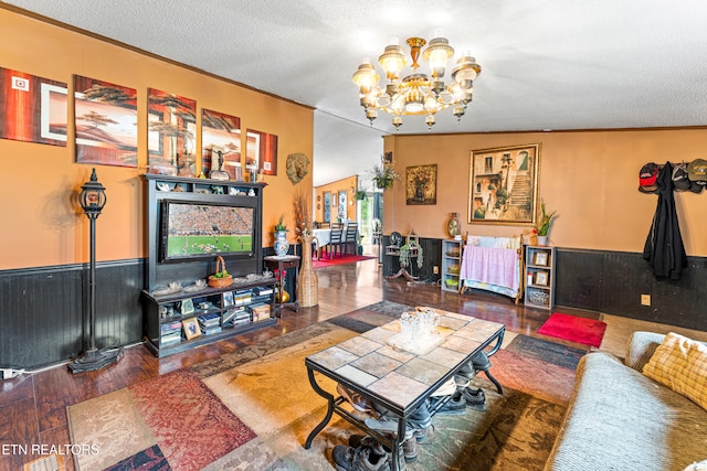 7726 Misty Point Way, Knoxville, TN 37914 - living room with a chandelier, a textured ceiling, crown molding, and wood finished floors