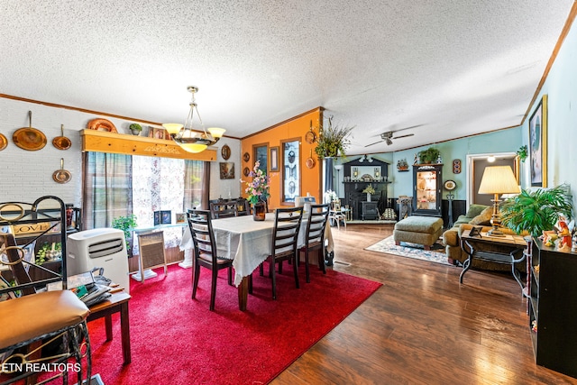 7726 Misty Point Way, Knoxville, TN 37914 - dining space with ornamental molding, wood finished floors, a textured ceiling, a chandelier, and vaulted ceiling