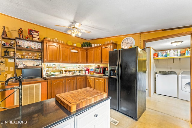 7726 Misty Point Way, Knoxville, TN 37914 - kitchen with black fridge, separate washer and dryer, a ceiling fan, a textured ceiling, and dark countertops