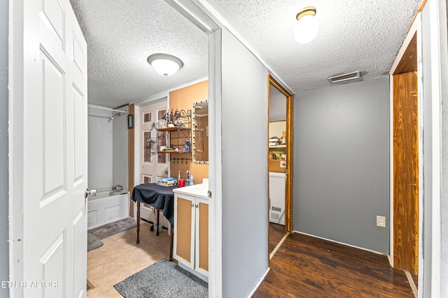 7726 Misty Point Way, Knoxville, TN 37914 - hallway featuring a textured ceiling and wood finished floors