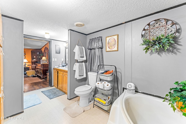 7726 Misty Point Way, Knoxville, TN 37914 - bathroom featuring a textured ceiling, vanity, a bath, toilet, and ensuite bathroom