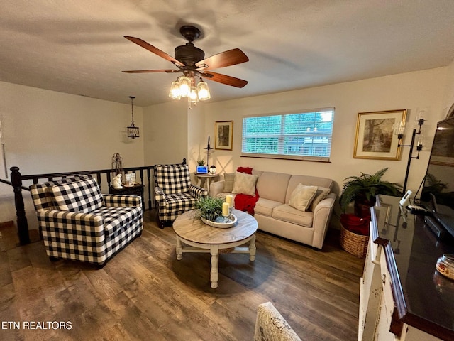 living area featuring ceiling fan and wood finished floors