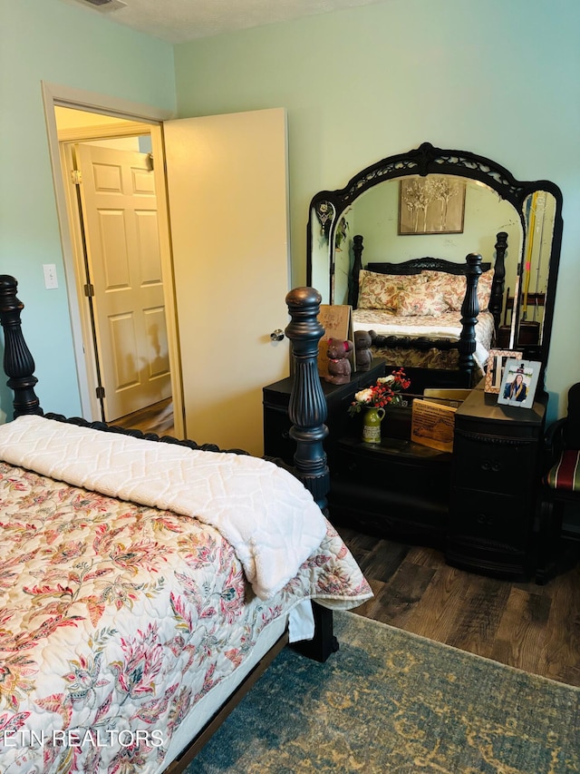 bedroom featuring wood finished floors