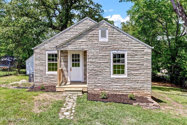 2423 Mccroskey Ave, Knoxville, TN 37917 - view of front of home with stone siding and a trampoline