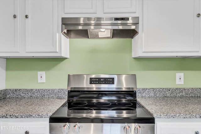2423 Mccroskey Ave, Knoxville, TN 37917 - kitchen featuring stainless steel electric stove, under cabinet range hood, and white cabinets