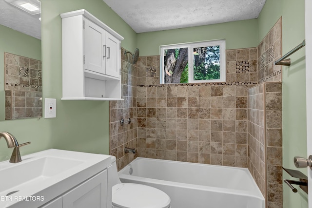 2423 Mccroskey Ave, Knoxville, TN 37917 - full bath featuring bathing tub / shower combination, a textured ceiling, toilet, and vanity