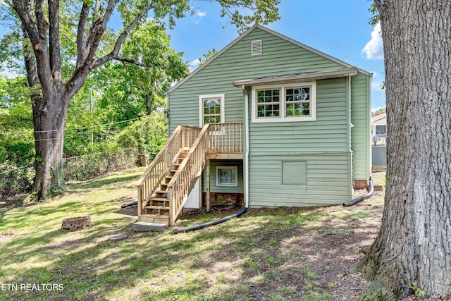2423 Mccroskey Ave, Knoxville, TN 37917 - rear view of house with stairway, a lawn, and a wooden deck