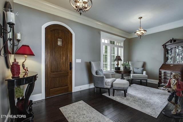 180 Edgewater Way, Lenoir City, TN 37772 - foyer with a chandelier, arched walkways, ornamental molding, baseboards, and wood finished floors