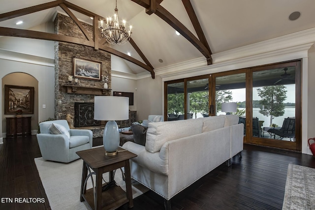 180 Edgewater Way, Lenoir City, TN 37772 - living room featuring beam ceiling, a chandelier, a stone fireplace, high vaulted ceiling, and dark wood-type flooring