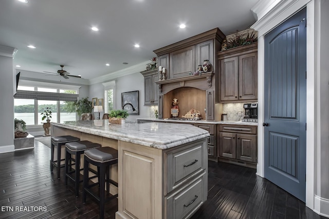 180 Edgewater Way, Lenoir City, TN 37772 - kitchen with ornamental molding, ceiling fan, an island with sink, recessed lighting, and dark wood finished floors