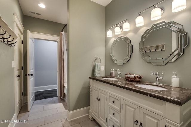 180 Edgewater Way, Lenoir City, TN 37772 - full bathroom with baseboards, curtained shower, double vanity, and recessed lighting