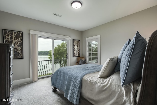 180 Edgewater Way, Lenoir City, TN 37772 - carpeted bedroom featuring access to exterior, baseboards, and a water view