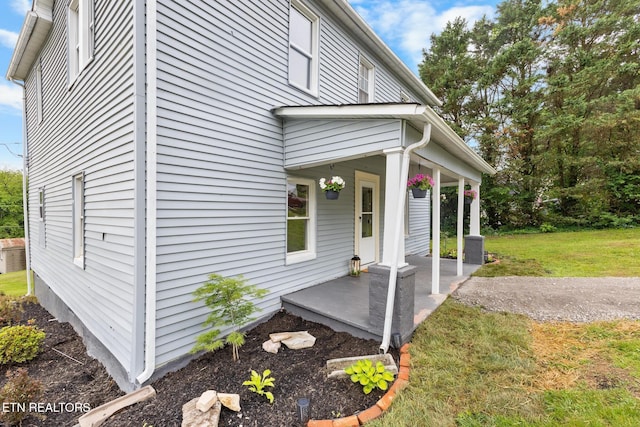 501 Ferry St, Loudon, TN 37774 - view of property exterior featuring covered porch and a lawn