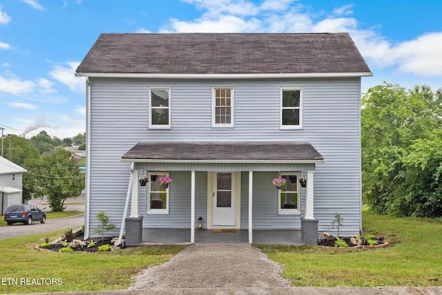 501 Ferry St, Loudon, TN 37774 - view of front of home with a porch, a shingled roof, and a front yard