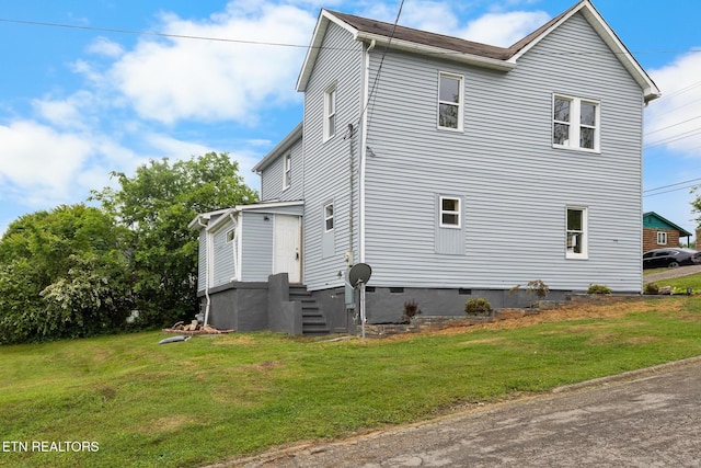 501 Ferry St, Loudon, TN 37774 - view of home's exterior with a lawn, crawl space, and entry steps
