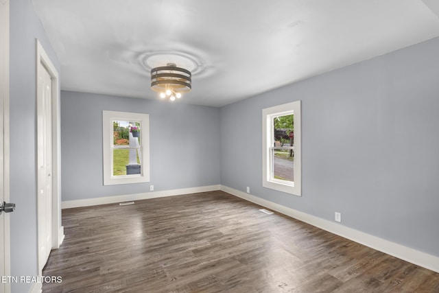 501 Ferry St, Loudon, TN 37774 - spare room featuring healthy amount of natural light, dark wood-type flooring, and baseboards