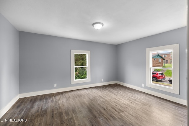 501 Ferry St, Loudon, TN 37774 - empty room featuring plenty of natural light, dark wood-type flooring, and baseboards