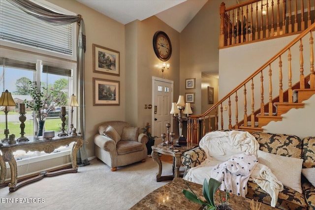 523 N 30th St, Middlesboro, KY 40965 - carpeted living area with high vaulted ceiling, stairs, and baseboards
