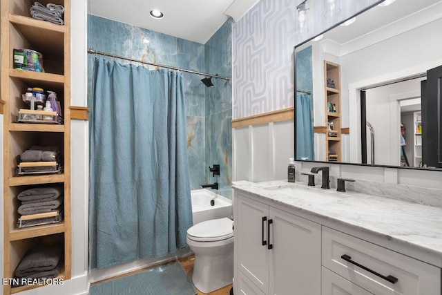 full bathroom with toilet, shower / tub combo with curtain, and vanity