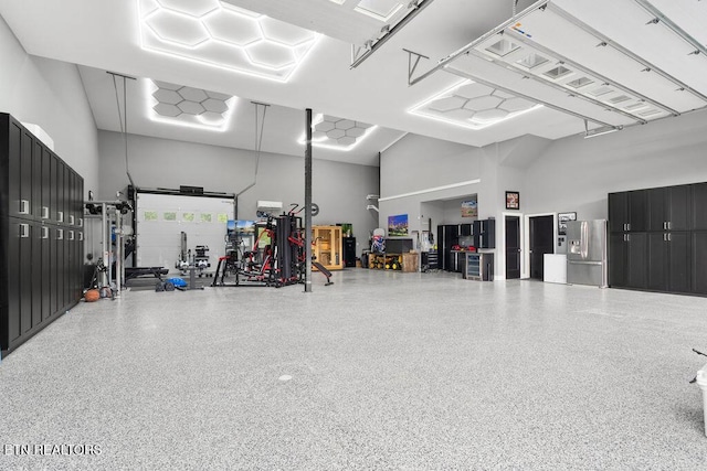 garage featuring stainless steel fridge