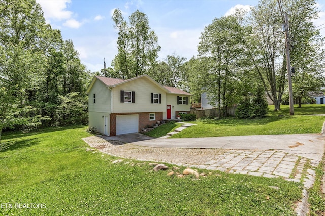 10212 Birch Hill Ln, Knoxville, TN 37932 - bi-level home with concrete driveway, brick siding, a garage, and a front yard