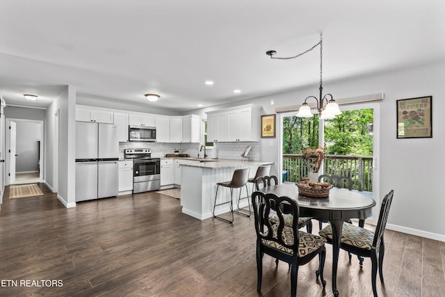 10212 Birch Hill Ln, Knoxville, TN 37932 - dining space with baseboards, recessed lighting, a chandelier, and dark wood-style flooring