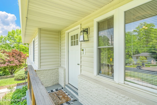 doorway to property with fence