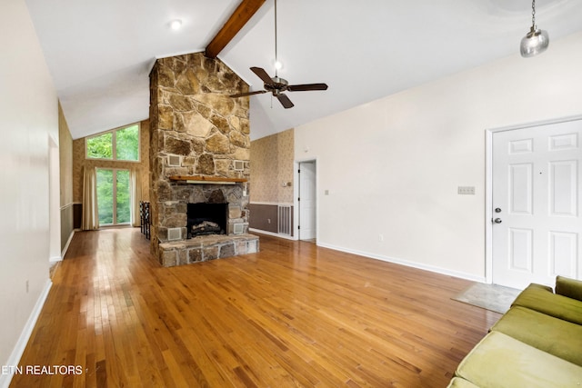 131 Clifton Cir, Oak Ridge, TN 37830 - living room with a ceiling fan, high vaulted ceiling, beamed ceiling, hardwood / wood-style floors, and a stone fireplace