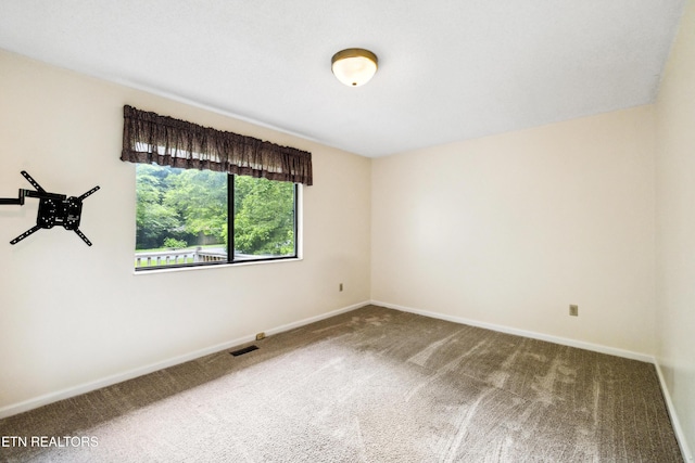 131 Clifton Cir, Oak Ridge, TN 37830 - spare room featuring carpet flooring and baseboards